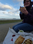 FZ019396 Jenni eating fish and chips with ferry coming in.jpg